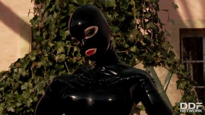 Fashionable lady Latex Lucy in black suit fucks with a red tool